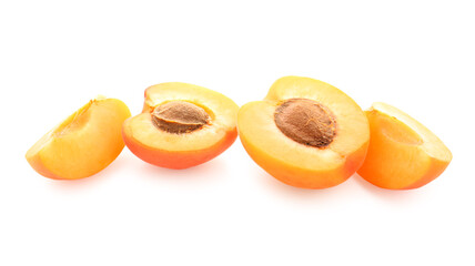 Ripe cut apricots isolated on white background