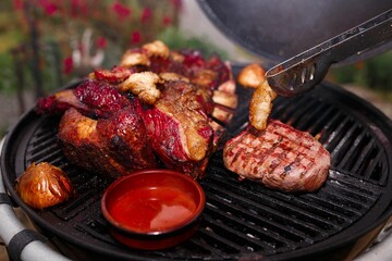 Closeup shot of meat placed on the grill preparing for a meal