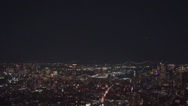 Cityscape of New York City seen from the Empire State Building at night in 4K