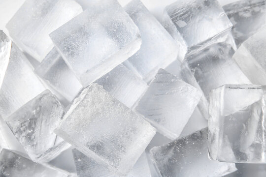 Many clear ice cubes as background, top view