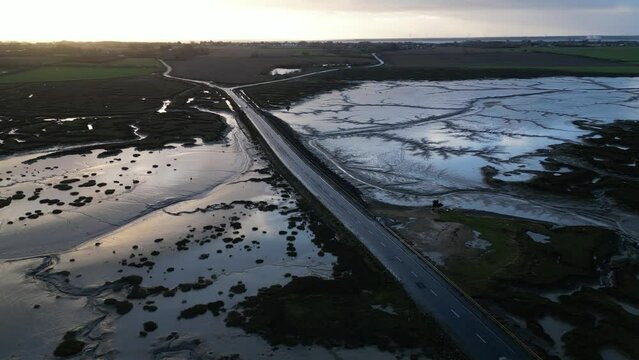 Drone footage of The Stroud causeway to Mersea Island at low tide.