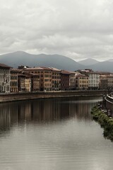 Beautiful view of the buildings in the historic centre of Pisa on river Arno