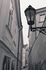 Fototapeta na wymiar Vertical of a broken lantern on an ancient building wall