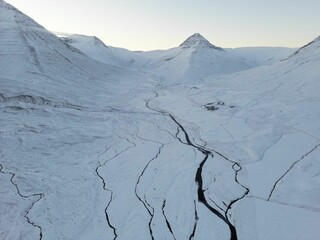 Beautiful snowy landscape with white glaciers and deep blue cracks in Iceland