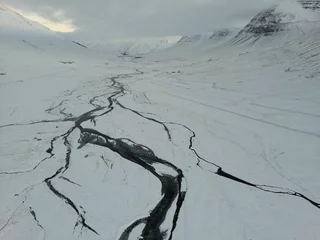 Foto op Plexiglas Beautiful snowy landscape with white glaciers and deep blue cracks in Iceland © Lukas Hartmann/Wirestock Creators