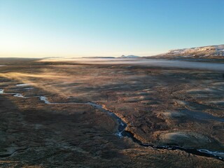 Aerial view of a river at foggy sunset. Iceland.