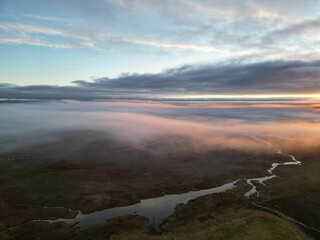 Drone view over the Reykjadalur Hot Spring Thermal River in Iceland at sunset