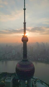 Aerial of the Oriental Pearl TV Tower in Shanghai agains the sunset sky