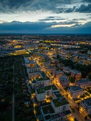 Obraz premium Drone vertical view of sunset cloudy sky over Munich cityscape with lights
