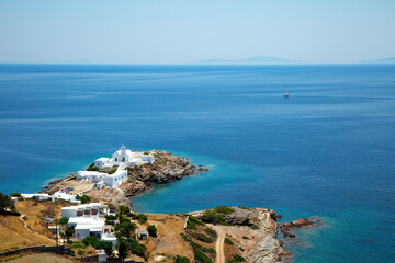 View of medieval monastery of Chrissopigi and coastline  in Sifnos  in Greece