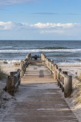 Beach Dune pier leading to Baltic sea on a sunny day, Kuhlungsborn, Germany