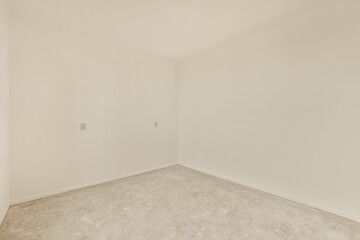an empty room with white walls and no one wall in the room is visible on the right side of the photo