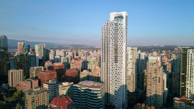 Fly over Vancouver's bustling downtown with stunning aerial footage of Burrard One High Rise.