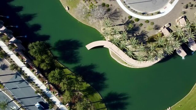 Top Aerial Shot Of A Highway On A  Sunny Day With Seascape View Near