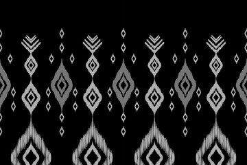 Ethnic ikat seamless pattern in tribal. Aztec geometric ethnic ornament print. Ikat pattern style. Design for background, wallpaper, illustration, fabric, clothing, carpet, textile, batik, embroidery.