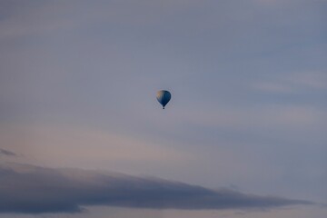 Scenic view of a hot air balloon floating in the air during a sunset
