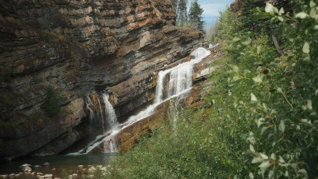 Water falling down the Cameron Falls in Waterton National Park. Slow motion. 