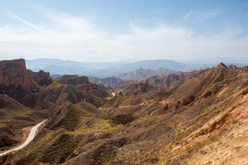 Naklejka premium Binggou Danxia close to Zhangye Danxia national geological park. Landscape of China with Danxia landforms at early morning