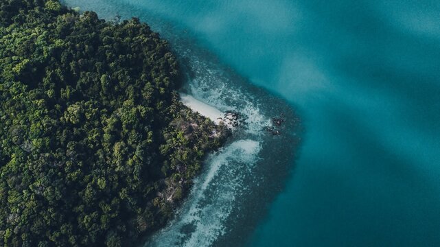 Drone view of the green island against the azure ocean © Touann Gatouillat Vergos/Wirestock Creators
