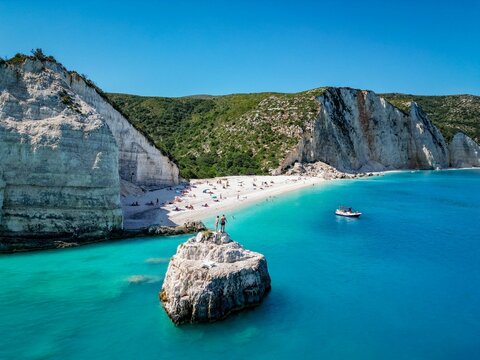 (4K) Couple holding hands at Fteri Beach, Kefalonia, Cephalonia, Greece