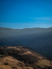 view from the summit of a large mountain in the distance