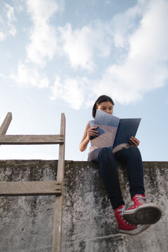 charming girl reading a book