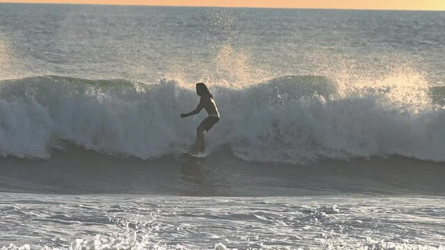 Surfer Riding on Surfboard in Beautiful Ocean Waves Slow Motion. Cool Paradise Adventure Leisure Island. Fun Sunny Day of Surfboarder in Blue Big Ocean. Pro Healthy Style with Splashing Sea Spray 4k