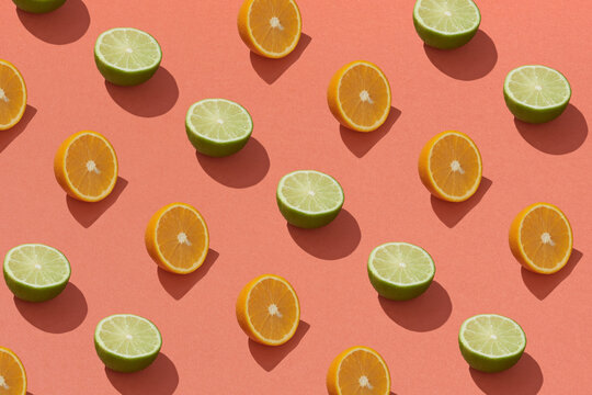 Lemon fruit pattern on red background. Repetition concept. Top view