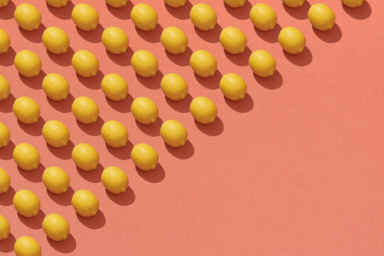 A pattern of whole yellow juicy lemons