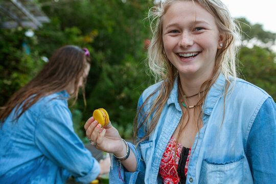 Woman eating macaron after pool