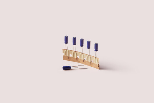 Capacitors attached with adhesive tape to cardboard.