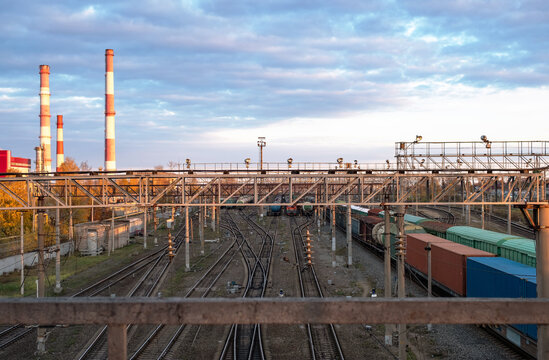 cargo wagons on sunset railroad tracks industrisl landscape  