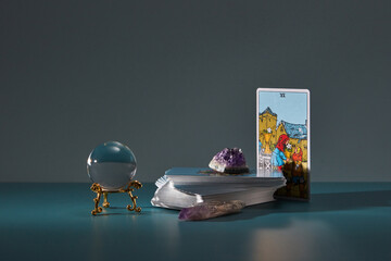 Crystal ball, tarot cards with visible Six of Cups.