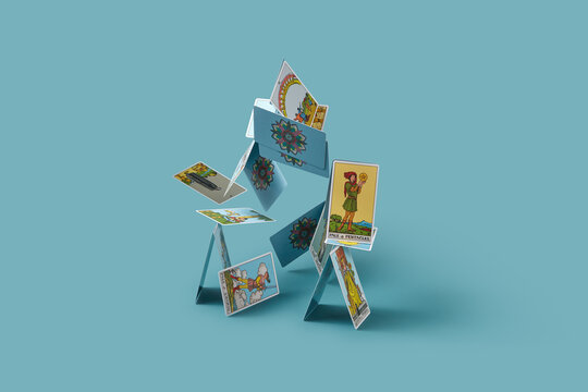 Classic tarot cards falling against blue background.