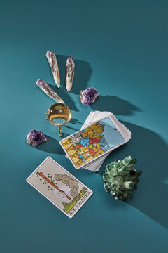 Deck of tarot with magic quartz and crystal ball, top view.