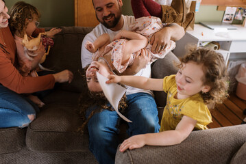 Family playing in living room together
