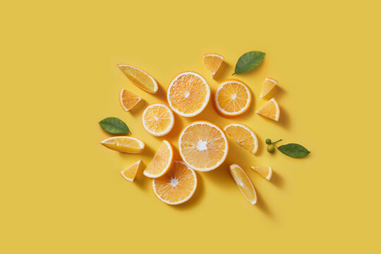 Fresh orange slices and green leaves.