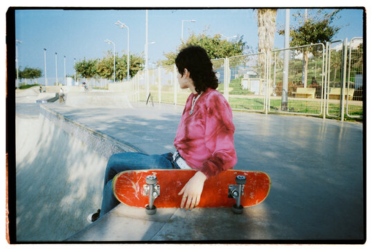 Teen girl posing in a skate park 