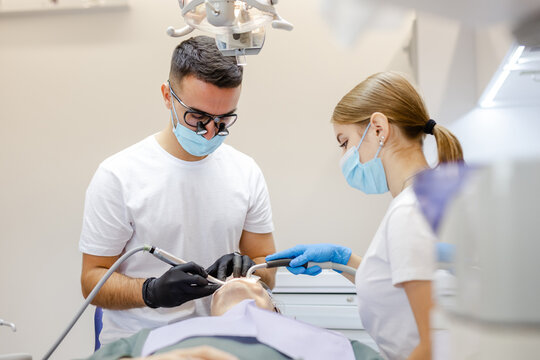 Dental workspace. Teamwork. PPE. Medical appliance. Proficient