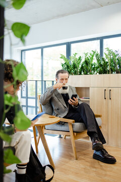 Beverage. Waiting room. Boomer patient. Clinic foyer. Client