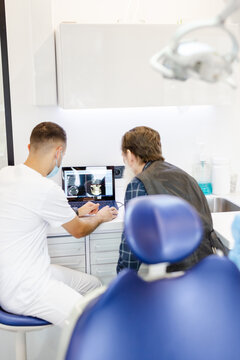 Modern diagnostic. Skilled dentist. Explanation. X-ray. Clinic