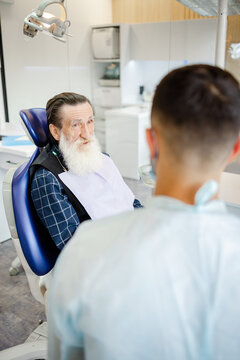Anonymous dentist. Consultation. Check up. Healthcare facility. Boomer