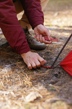 Anonymous set up tent camping activity fastening 