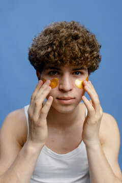 A man puts patches under his eyes