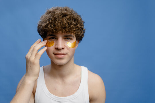 A man puts patches under his eyes