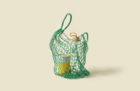 Mesh bag with reusable cup and stylish bottle.