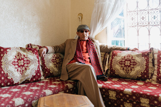 Elegant senior arabic gentelman posing at home