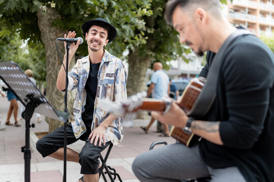 musical couple giving a concert in the street