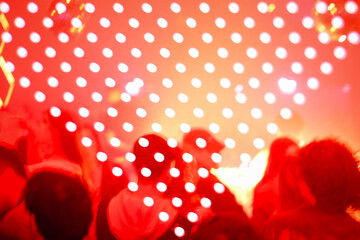 Anonymous party people having fun and light dots triangle 