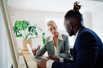 Colleagues working together in an office space